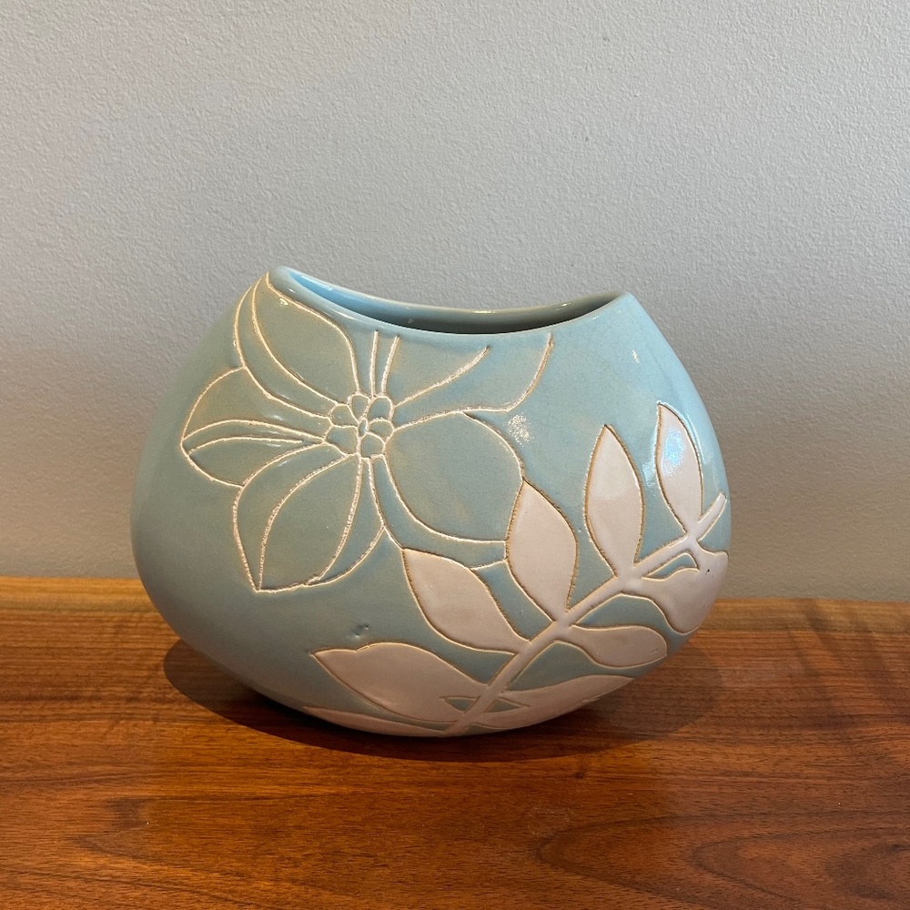 Pale blue HD Designs ceramic vase with white flowers